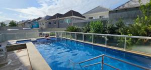 a large swimming pool with a person sitting in it at Option Full Service Residence in Rio de Janeiro