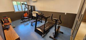 a gym with two treadmills and a treadmill at Option Full Service Residence in Rio de Janeiro