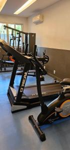 a gym with several tread machines in a room at Option Full Service Residence in Rio de Janeiro