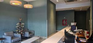 an office with a christmas tree on the wall at Option Full Service Residence in Rio de Janeiro