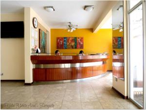 a lobby of a hotel with a reception desk at Hotel Monte Azul in Tarapoto