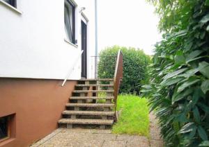 a stairway leading up to a house with a stair case at Best in Town in Walldorf