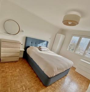 מיטה או מיטות בחדר ב-Bel appartement de 77m2 à Boulogne au pied du métro