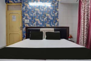 Säng eller sängar i ett rum på SPOT ON Hotel Drip Inn