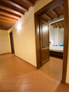 a room with a door leading to a bedroom at Casale dei cento Acri in Florence +101 photos