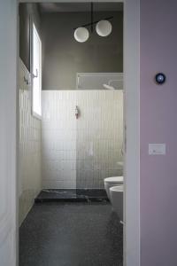 a bathroom with a sink and a toilet and a window at Family apartment with Terrace in Venice