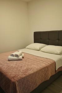 Postel nebo postele na pokoji v ubytování Villa Mangata Apartments