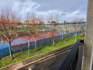 a view of a river from a window with trees at Apartamento en Terra do Porto con vistas in O Grove