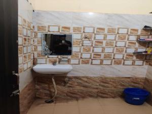 Kúpeľňa v ubytovaní OYO Maan Hotel