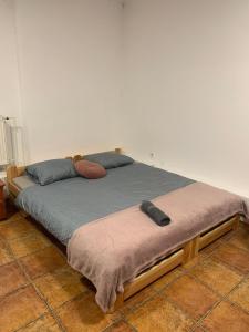 two beds sitting next to each other in a room at Central and affordable room in basement in Krakow