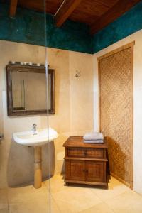 a bathroom with a sink and a mirror at Finca Tomaren in San Bartolomé