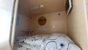 Postel nebo postele na pokoji v ubytování Happy Hotel