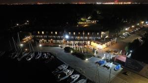 a building with a marina at night with lights at Hotel Galion in Gdańsk
