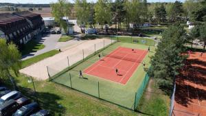 an overhead view of a tennis court with people on it at Hotel Galion in Gdańsk +90 photos