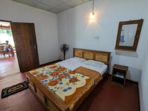Postelja oz. postelje v sobi nastanitve DILSHAN HOTEL Diyaluma