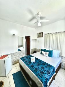 Postel nebo postele na pokoji v ubytování Pousada Villa Real Paraty - Localização e café da manhã EXCELENTES"