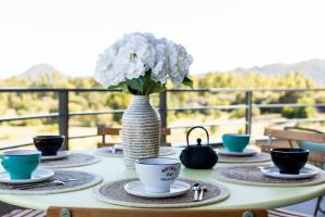 A balcony or terrace at Le Gaston - Appartement vue dégagée Porto Vecchio