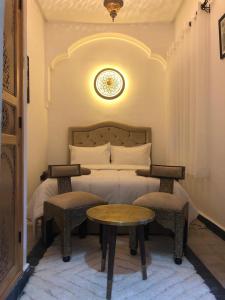 Postel nebo postele na pokoji v ubytování Riad Orient Palace