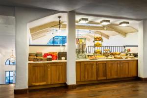 a kitchen with a counter with food on it at Hotel Pacific in Monterey