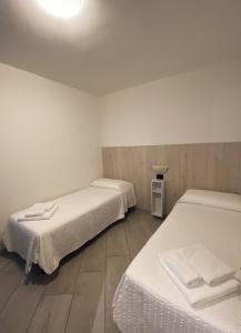 A bed or beds in a room at ALLA CAMPANELLA