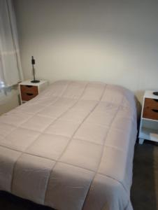 En eller flere senge i et værelse på La casita de los aromos + 6 billeder