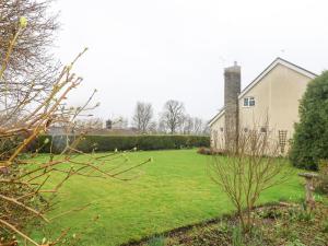 a house with a yard with a grass field at Glyde House in Dorchester