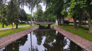 Vonkajšia záhrada v ubytovaní Nice River - MAZURIA APARTAMENTY