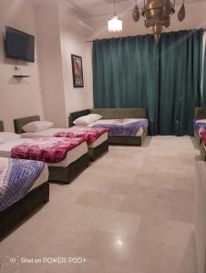 En eller flere senger på et rom på Riad Passiflora