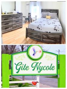 una habitación con cama y una señal para una nopsia de regalo en Gîte Nycole en Perce