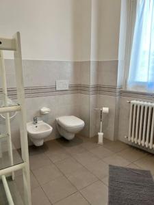 a bathroom with a toilet and a sink at [Como-Svizzera] La casa di Betty in Lurate Caccivio