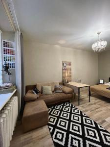 a living room with a couch and a table at Apartment Kyiv in Kyiv