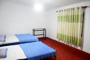 Postel nebo postele na pokoji v ubytování Carmalin Holiday Bungalow