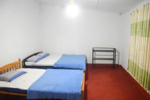 Postel nebo postele na pokoji v ubytování Carmalin Holiday Bungalow