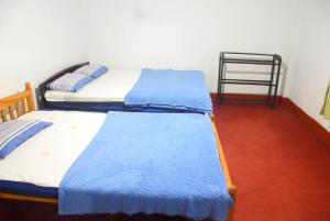 Postel nebo postele na pokoji v ubytování Carmalin Holiday Bungalow