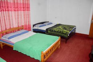 Postel nebo postele na pokoji v ubytování Carmalin Holiday Bungalow