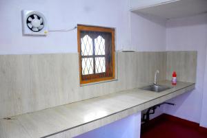Kuchyň nebo kuchyňský kout v ubytování Carmalin Holiday Bungalow