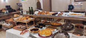 a buffet with many different types of pastries and desserts at Hotel Albret in Pamplona