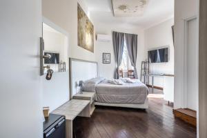 A bed or beds in a room at Relais Incantesimo Vaticano