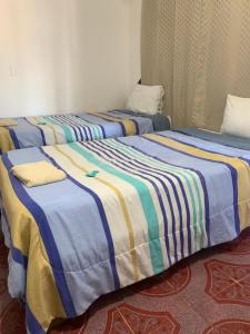 Postel nebo postele na pokoji v ubytování Hotel Puerto Real