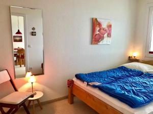 Ein Bett oder Betten in einem Zimmer der Unterkunft Ferienwohnung Leuchtturm 21