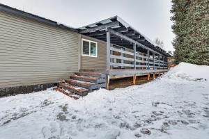 a building with snow in front of it at Downtown Cascade Vacation Rental Less Than 1 Mi to Lake! in Cascade