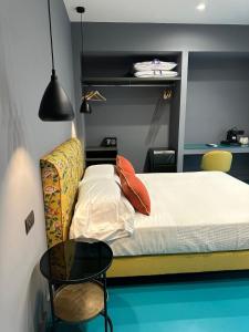 Postel nebo postele na pokoji v ubytování Sorrento Rooms Deluxe