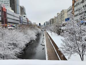 a river in a city covered in snow at LaonHajae in Seoul