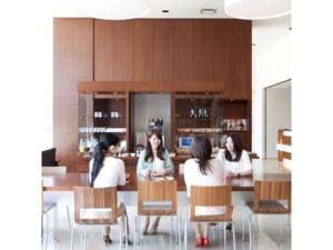 four women sitting at a table in a room at Hotel day by day - Vacation STAY 93900 in Hamamatsu
