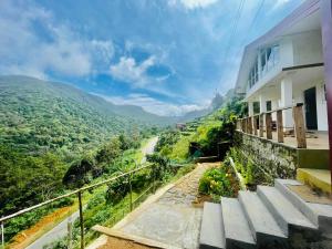 a stairway leading up to a building with a view at Forest View Villa (Bangalahatha) in Nuwara Eliya