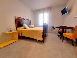 Postel nebo postele na pokoji v ubytování Il Trovatore Rooms