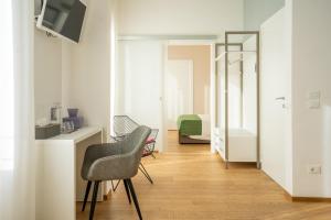 Televízia a/alebo spoločenská miestnosť v ubytovaní B&B Villa Rosa
