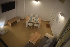 TV a/nebo společenská místnost v ubytování LOFT Reyes Católicos Parking privado INCLUIDO