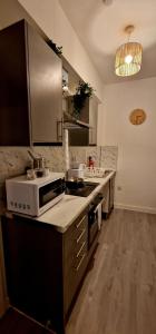 A kitchen or kitchenette at ApartHotel Flat 9 - 10 min to centre by Property Promise