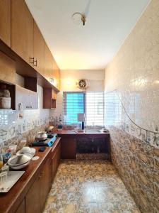 a kitchen with a counter and a sink in it at Entire place-4BHK Apartment Bashundhara R/A in Dhaka